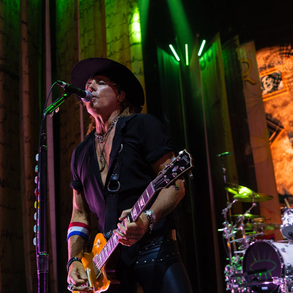 Guitarist Ryan Roxie of Alice Cooper performing live on stage.