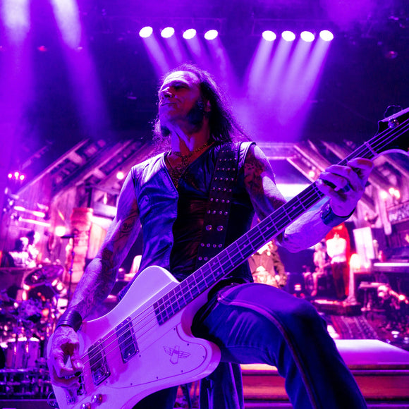 Bassist Chuck Garric of Alice Cooper performing live on stage.