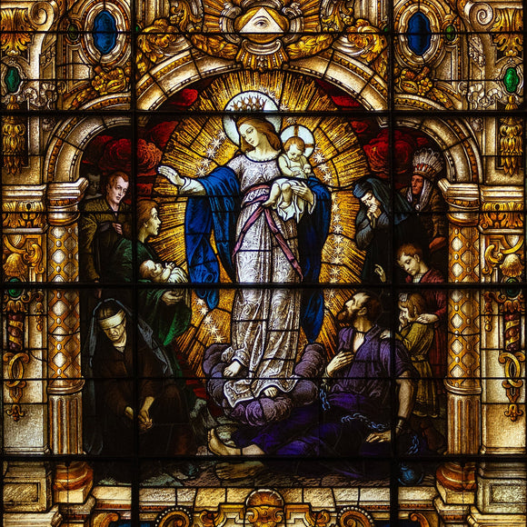 Stained glass window in Mother Of God Church, Covington, Ky depicting the Virgin Mary and baby Jesus.
