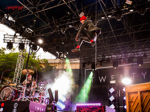 Tyler Joseph of Twenty One Pilots leaping. ©2015 Steve Ziegelmeyer