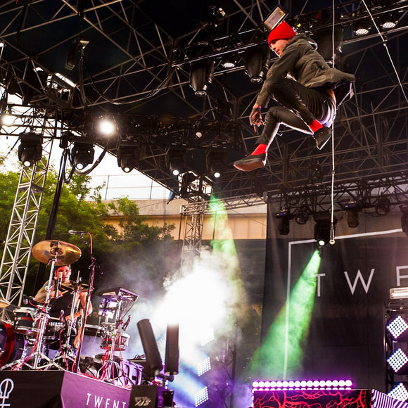 Tyler Joseph of Twenty One Pilots leaping. ©2015 Steve Ziegelmeyer