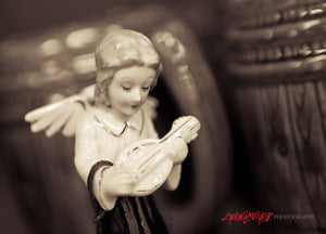 Ceramic angel with lute. ©2011 Steve Ziegelmeyer