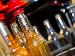 Filling bottles on assembly line. Dominion Liquid Technology. ©2013 Steve Ziegelmeyer