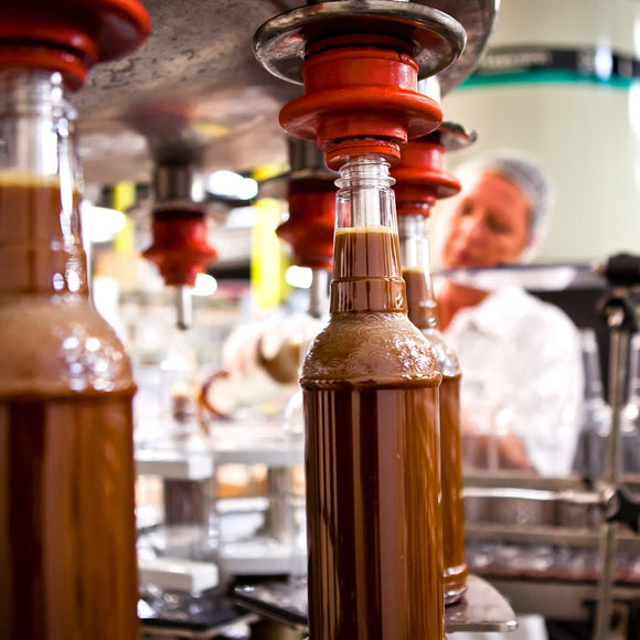 Filling bottles on assembly line. Dominion Liquid Technology. ©2013 Steve Ziegelmeyer