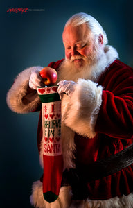 Santa Claus filling stocking. ©2017 Steve Ziegelmeyer