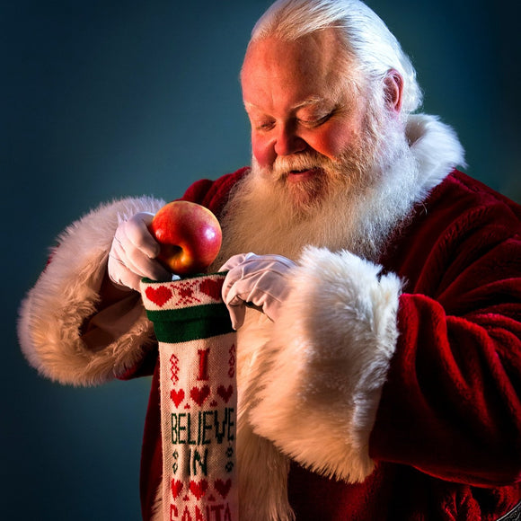 Santa Claus filling stocking. ©2017 Steve Ziegelmeyer