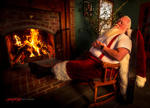 Santa Claus sleeping in front of fireplace. ©2017 Steve Ziegelmeyer
