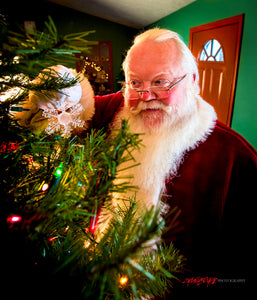 Santa Claus decorating tree. ©2017 Steve Ziegelmeyer