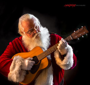Santa Claus playing guitar. ©2018 Steve Ziegelmeyer