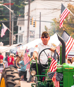 Veteran on tractor in parade. ©2015 Steve Ziegelmeyer
